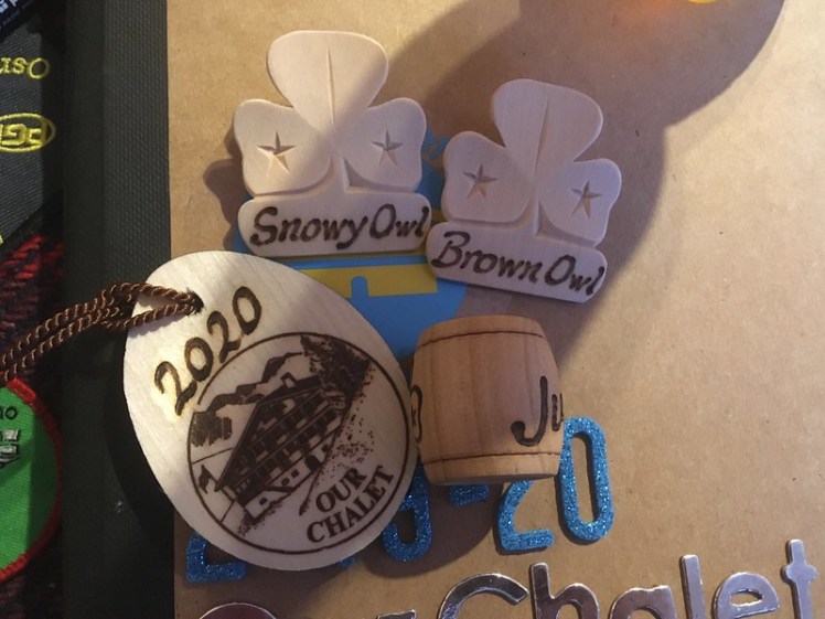 Backpack tag, two name badges & a woggle from the Adelboden woodcarver