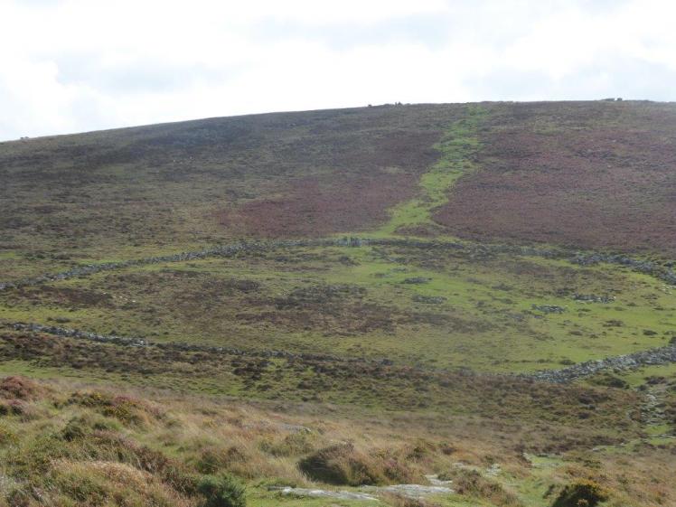 Grimspound Bronze Age settlement: the remains of stone houses within a vast stone circle