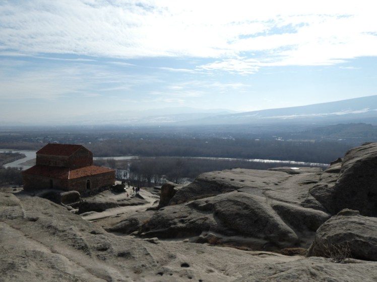 A view from right up the top of Uplistsikhe. Even the church is now below me. Beyond, the bright sunlight kind of whites out a view that could go on for miles.