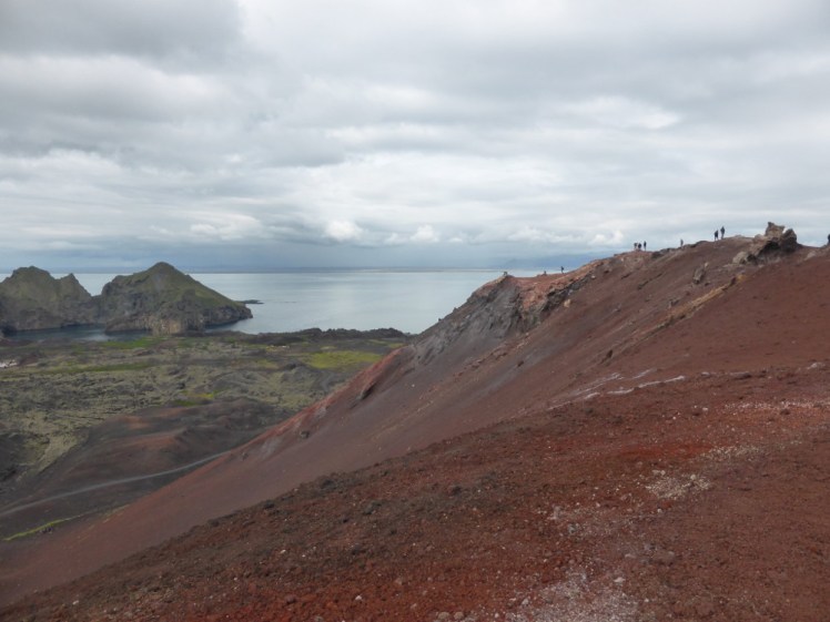 Eldfell's crater with the narrowed harbour entrance in the background