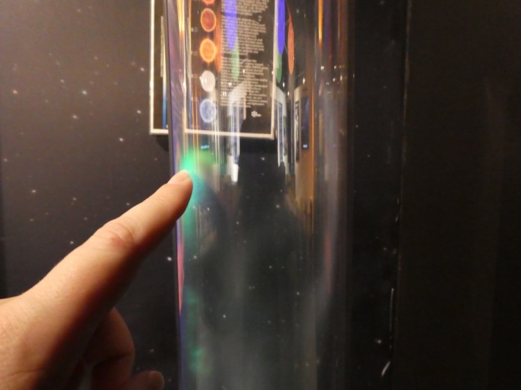 Making miniature Northern Lights around my finger in some kind of plasma tube.