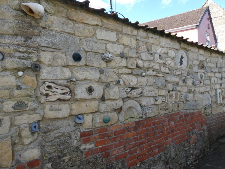 Someone's souvenirs embedded in their wall