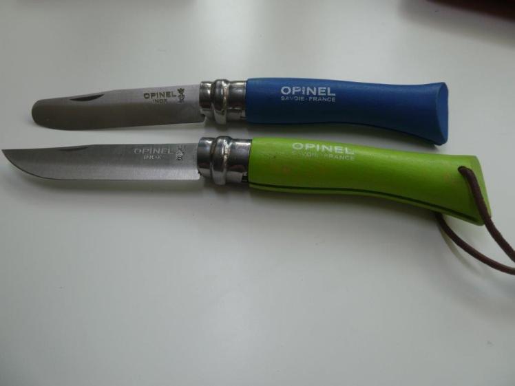 Opinel No.7 knives. The blue one is rounded, the green one sharp. The cutting blade on both is equally lethal.
