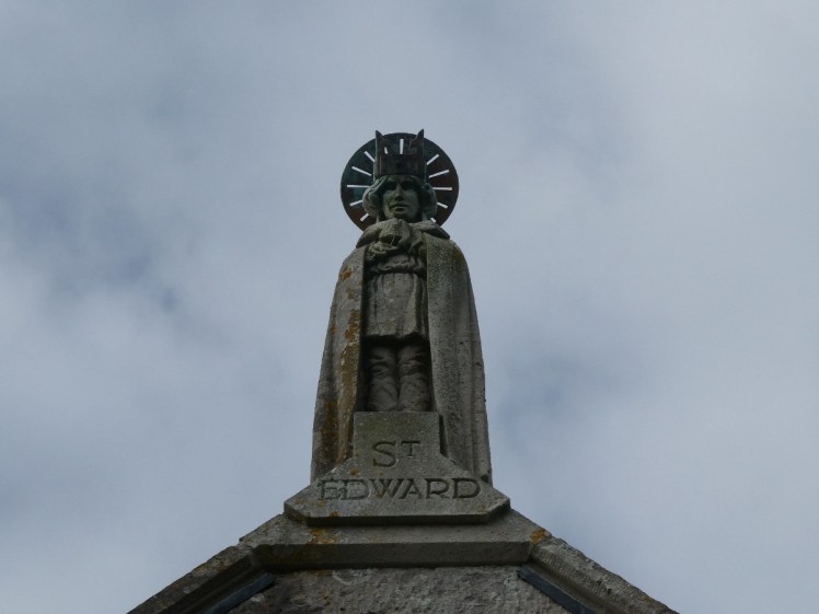 Statue of Edward the Martyr on the roof of St Edward's Church in Corfe Castle