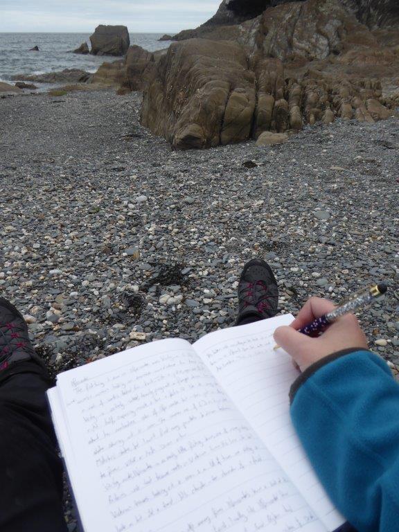 Writing on the beach at Ilfracombe