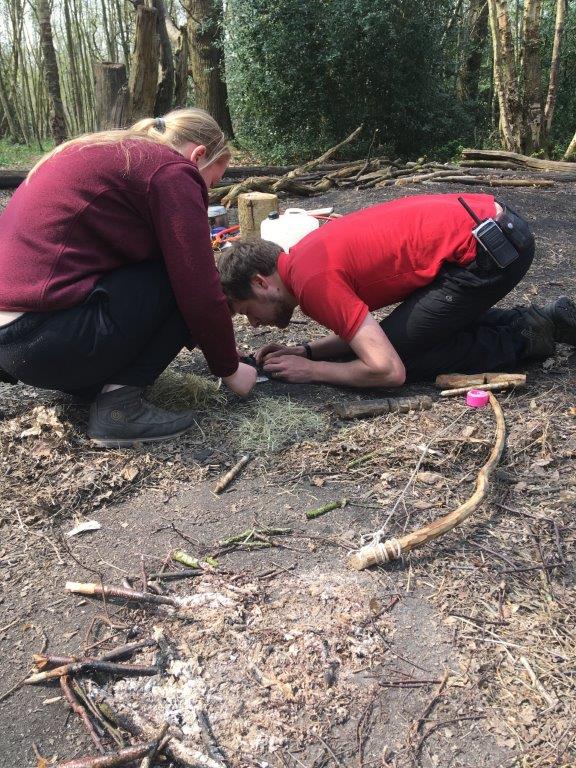 Firelighting by friction using a bow drill