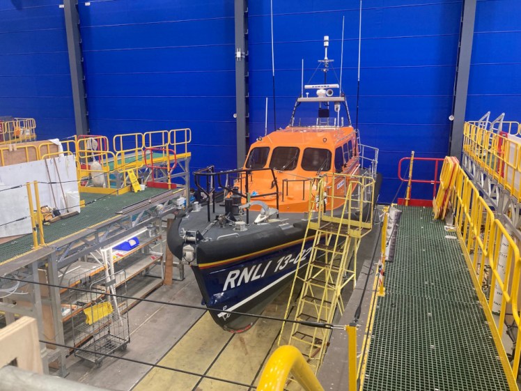 A Shannon-class lifeboat sitting in one of the bays waiting to be weighed and have its engines and/or jets fixed.