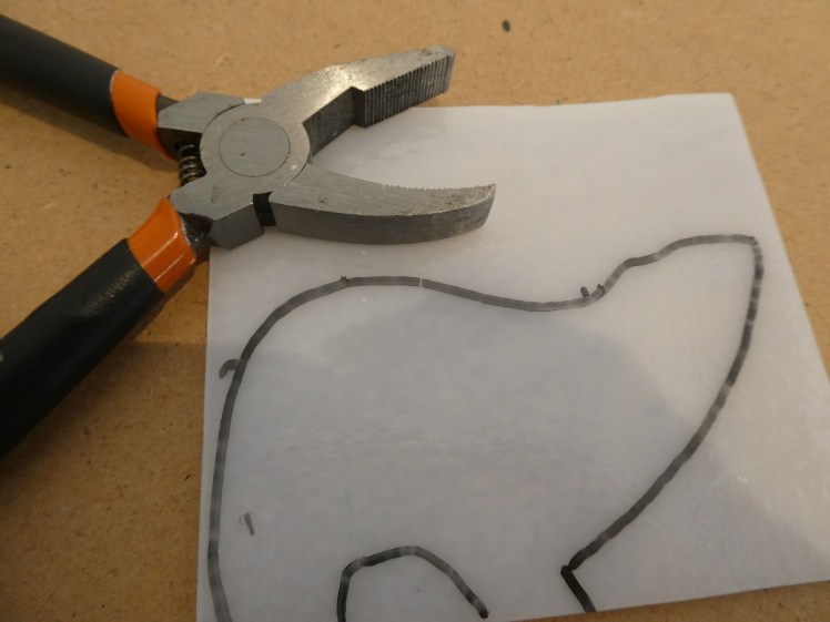 Polar bear traced onto glass and ready for cutting