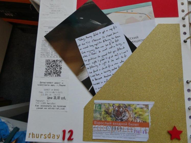 Gold angled pocket taking up nearly half a page, containing a folded map, a spare photo and a journalling card.