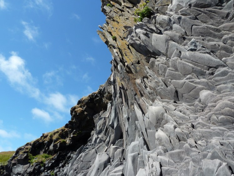 Striking cliffs below Fjöruhúsið cafe, near Hellnar