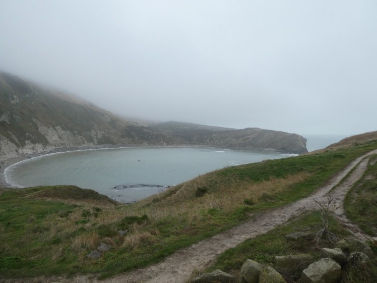 Lulworth Cove in the winter mist and drizzle