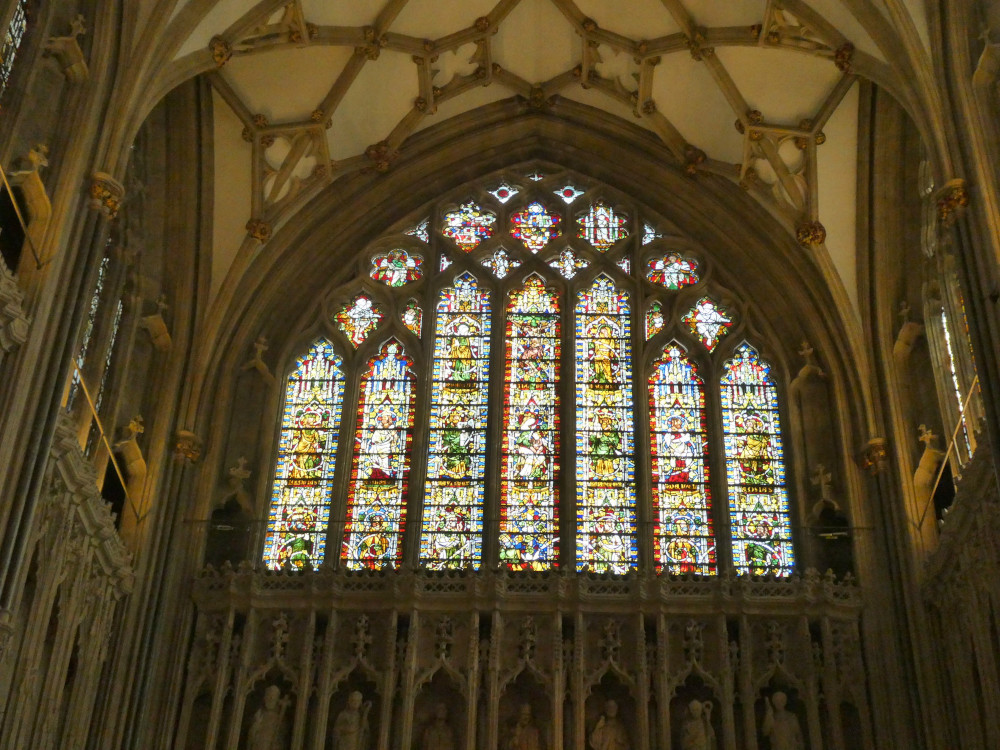 A spectacular medieval stained glass window. At this distance you can't pick out a lot but you can see plenty of yellow and green.