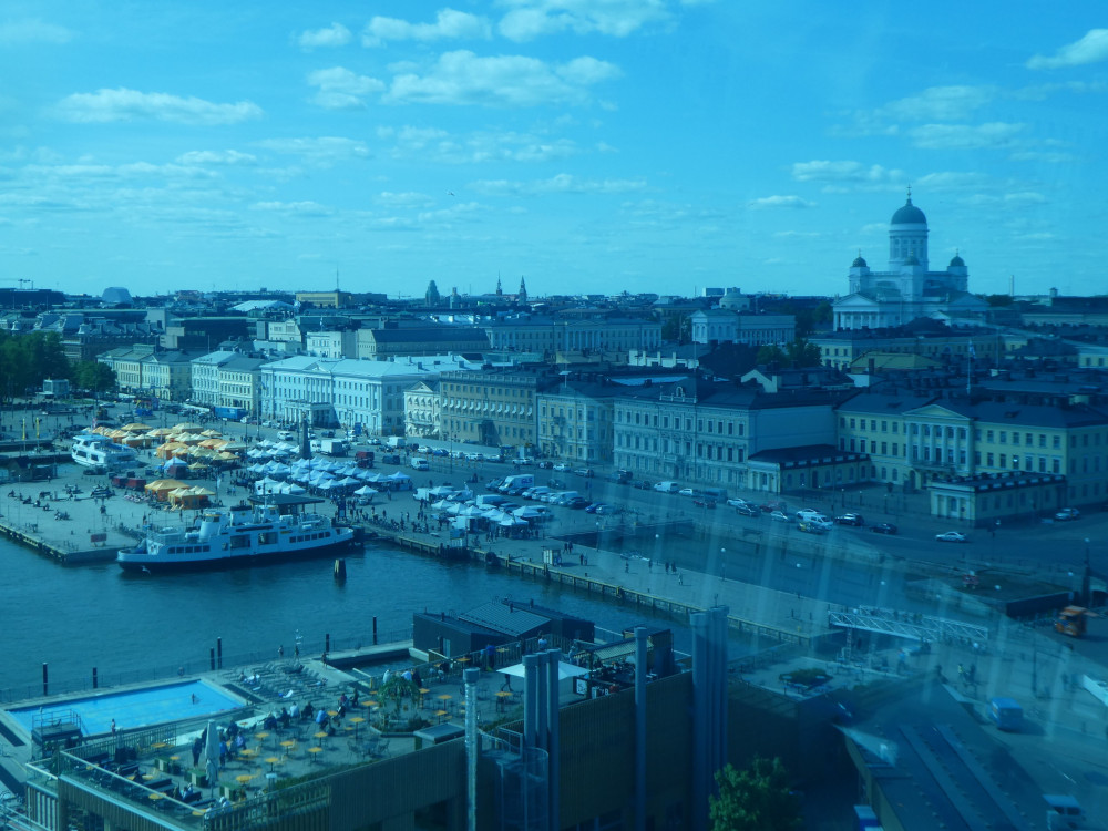 A view over Helsinki's South Harbour, Allas Sea Pool and Helsinki Cathedral as seen from behind some very blue glass most of the way up the SkyWheel.