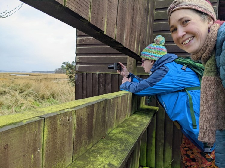 Me and Catherine in the hide. I'm photographing the curlew while Catherine grins at the camera.