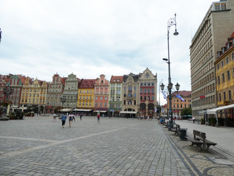 Wrocław's Stary Rynek, Old Market Square, in the grey of the morning. It's a lot quieter than in the evening but just as colourful.