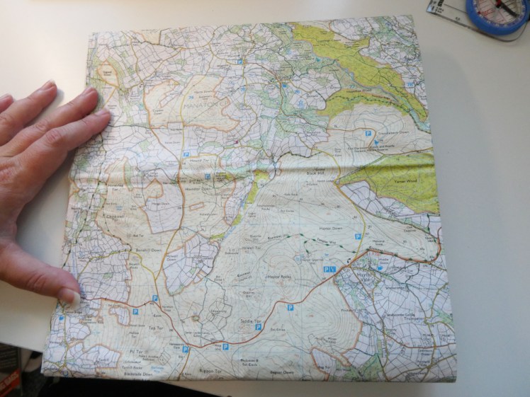 The huge map folded awkwardly to show the area around Haytor.