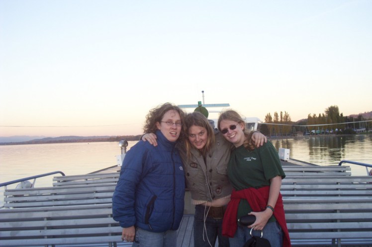 The "triplets" on their first trip out, a boat trip on the lake around sunset. From left to right: Angela, wearing a puffy blue snow jacket, Jemma in a khaki cropped jacket and me in a green t-shirt although I've got a red jumper tied around my waist. Spot the person who lives in a desert...