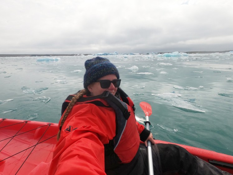 Me in a red jacket, buoyancy aid and kayak, out on the turquoise, ice-packed waters of Jökulsárlón.