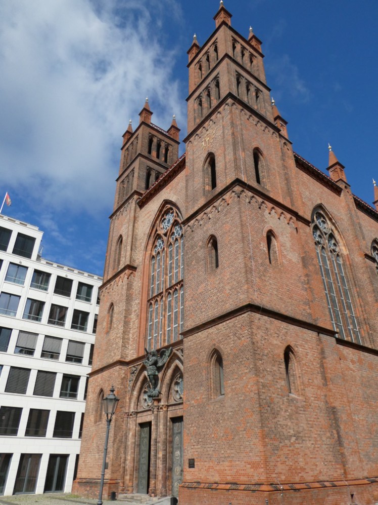Friedrichswerdersche Kirche, a red brick Gothic church with very square plain towers on the front.