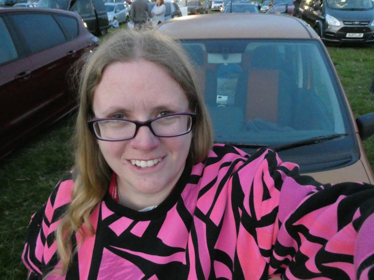 Selfie sitting on the front of my own car.
