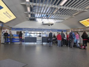 Reykjavik Domestic Airport check-in. It's a hall with three desks. To the right is a room that serves as two of the departure gates and has a food counter. To the left is another. You can't see either of them in the photo but that's it, that's all the airport consists of.