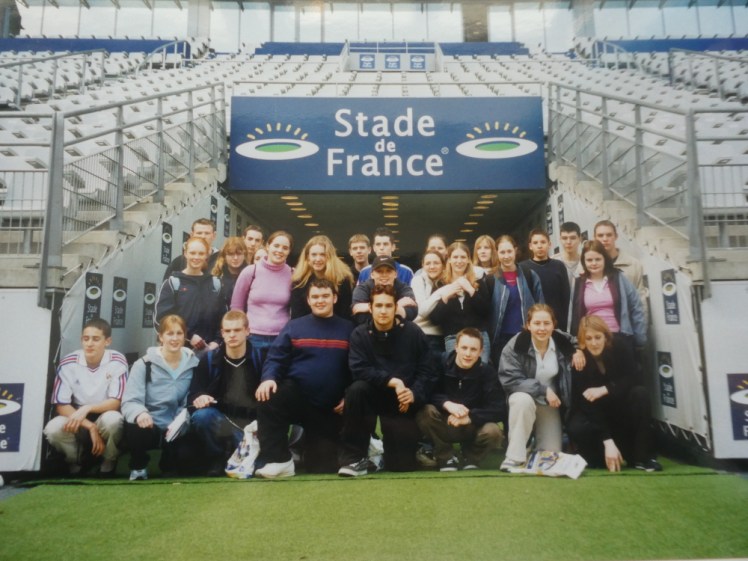 The entire school group gathered at the entrance to the tunnel at Stade de France, with a banner over our heads.