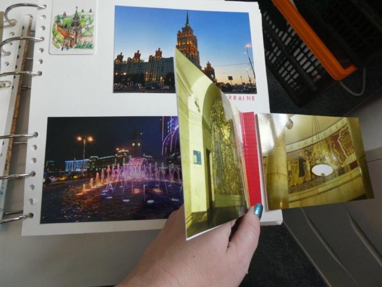 The same page as before but with the hinged photos opened to reveal more photos on the back and underneath.