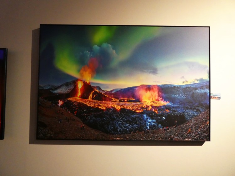 Green aurora dancing over the 2021 Fagradalsfjall eruption; fire fountains and rivers flowing from the young volcano under the Northern Lights.