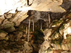 A cleft within the cave, filled with stalactites and stalgmites.