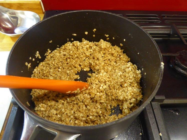 Making flapjack: mixing the oats into the syrup mixture