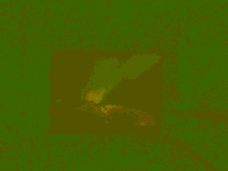 A hideous green square with a more olive-green square in the middle and an extremely low-rest ghostly image of the Northern Lights over a volcano in pixelly shades of yellow, green and a hint of orange. This is not a lesson in how to photograph the Northern Lights.