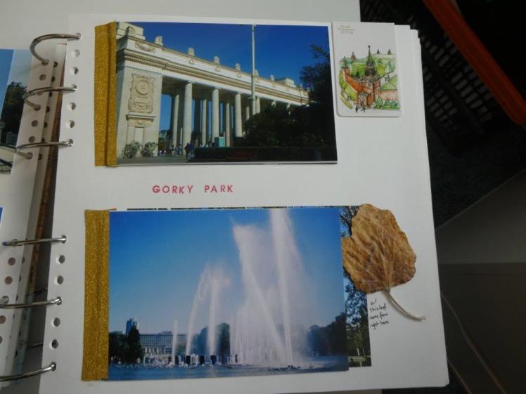 Another quiet page, with photos of Gorky Park - those words are stamped in red ink between the photos. There's also a leaf stuck there and a magnetic bookmark at the top.