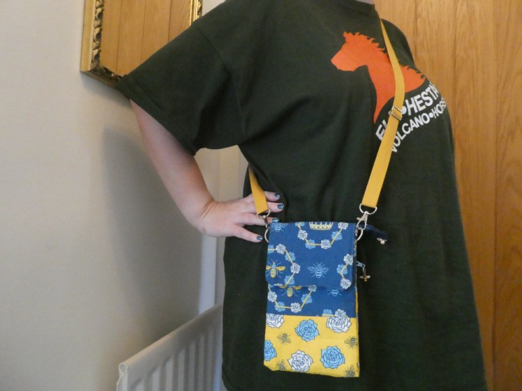 Me, wearing my big dark green Eldhestar t-shirt and the finished bag which has a matching yellow webbing strap.