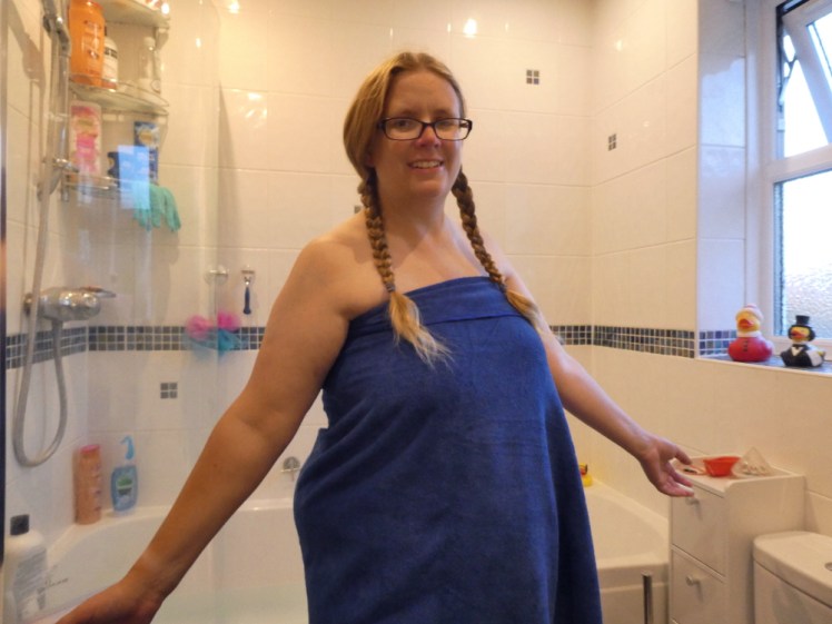 Me prancing around in a very thin, very light but very soft and fluffy blue travel towel