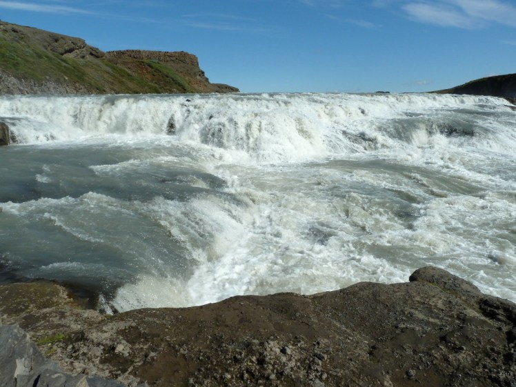 GUllfoss seen from the flake of rock that sticks out in the middle of the roiling tumbling waters.