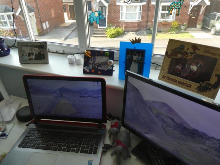 Four photos on my window sill. They're with my caving club, with friends in Paris, three best friends as bridesmaids and the bride and two of us on Big Thunder Mountain at Disneyland Paris.
