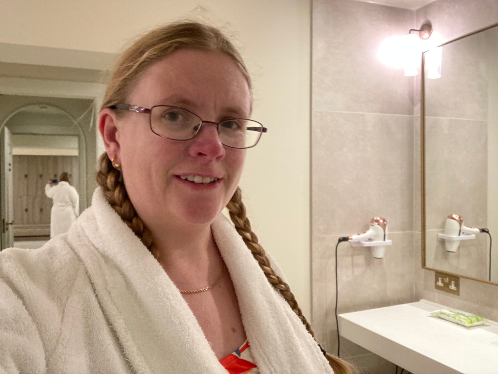 A selfie in my robe in the empty off-white changing rooms.