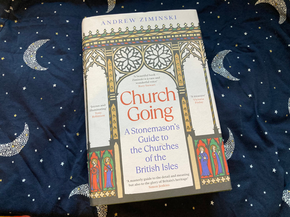 Church Going by Andrew Ziminski, a hardback book with a cartoon of various church architecture in bright colours on it.