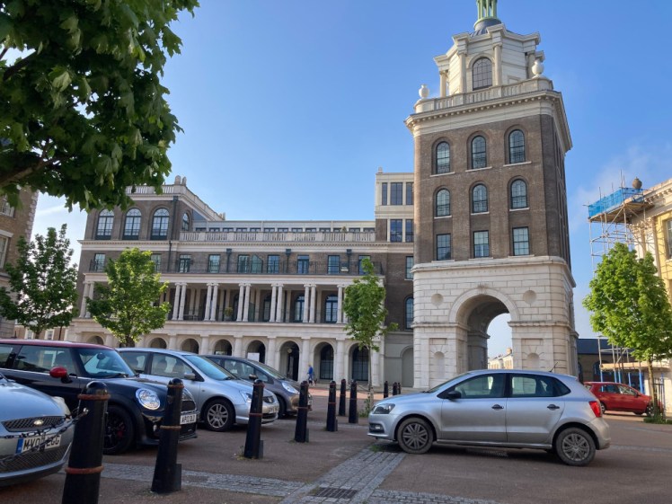 The Royal Pavilion in Poundbury, a neoclassical building with a large square tower on the far end.