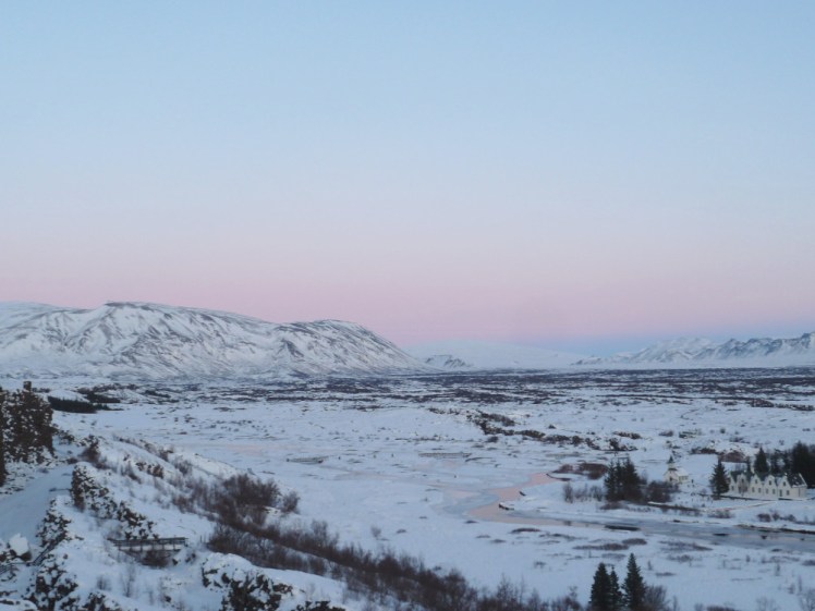 The snowy view from the top of the Thingvellir viewpoint, with a perfect pastel sky as the sun starts to think about setting.
