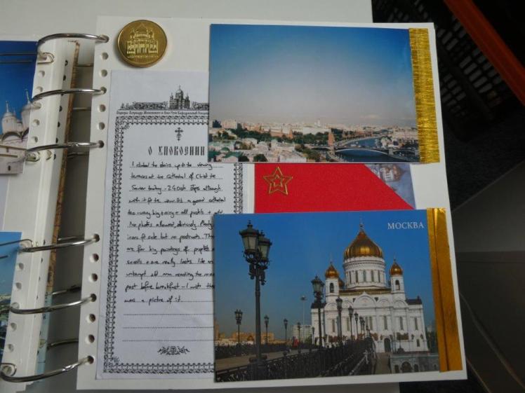 The last Moscow page of my scrapbook. There's a gold souvenir coin in the top corner, two hinged photos of the cathedral and its view and a prayer slip with that day's journalling on it.