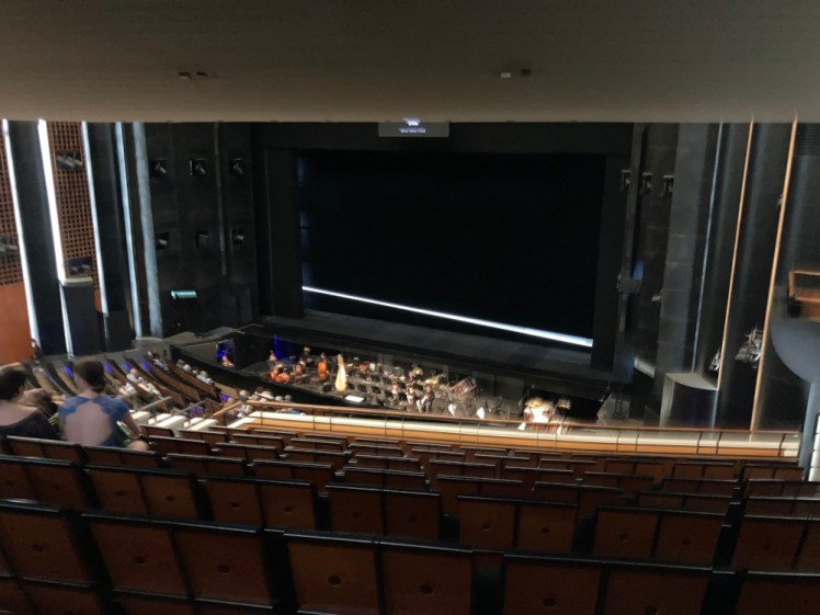 The view from my seat in the first balcony. The bottom of the second balcony cuts off the upper part of the stage but I can see the stage itself and the orchestra from here.