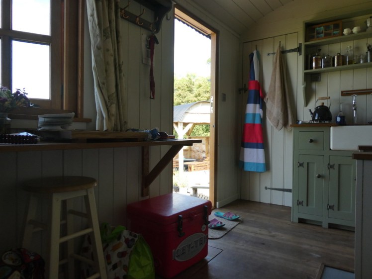 The layout of the hut (red fridge visible)