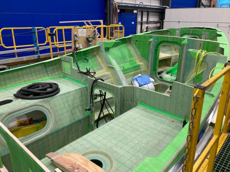 A Shannon in stage 2. It's the inside of the bottom of the lifeboat, all filled with green tape and off-green square-marked material and it's having its bulkheads and engine compartments put in.