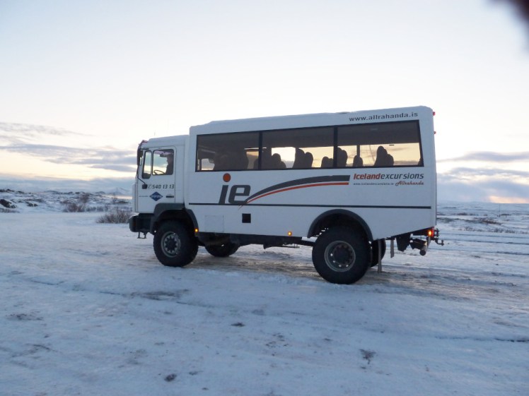 The expedition truck I did my first Golden Circle in. It's a tall but squat vehicle with high suspension parked in the snow.
