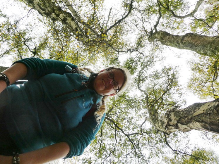 Ludicrous selfie in the trees from a camera lying flat on the ground
