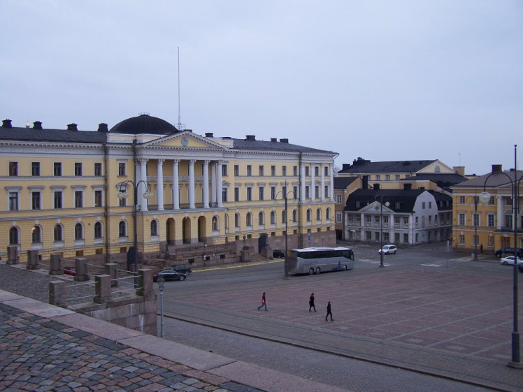 Senate Square, a brick-floored square surrounded by yellow Neoclassical buildings.