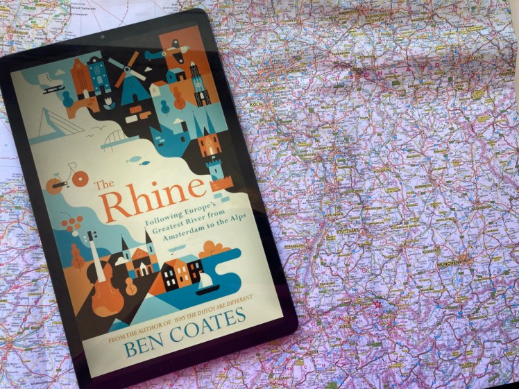 Cover of The Rhine by Ben Coates on my tablet, lying on a map of Europe folded to roughly the German Rhine area.