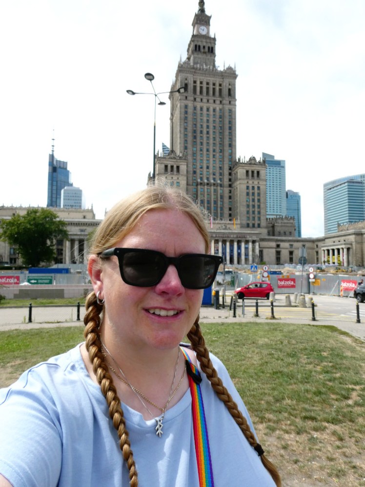 A selfie outside the Palace of Culture and Science, a huge Soviet yellowish stone skyscraper. It's closer to Art Deco than modern glass skyscrapers and it's only about 50 storeys.