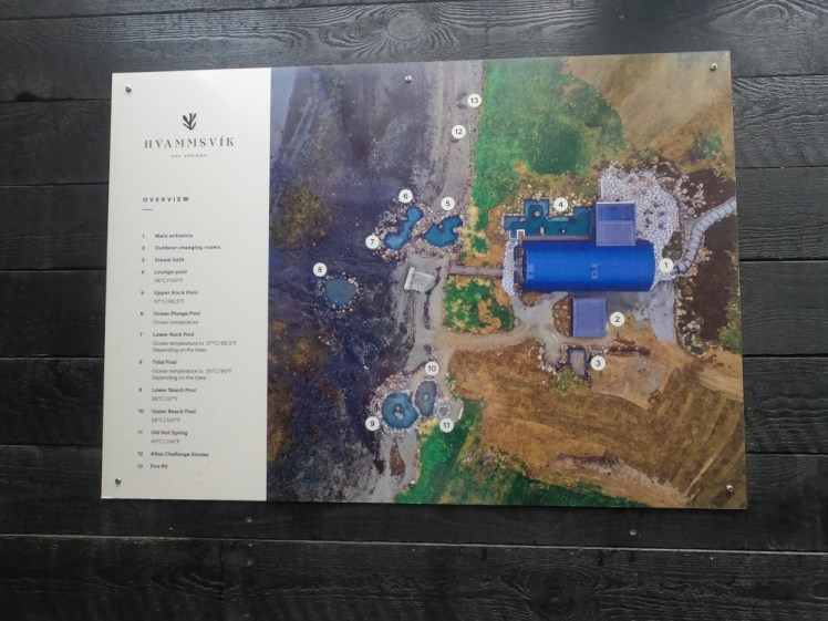 A map of the site, in the form of an aerial photo at low tide with the various pools numbered and a key down the left showing what they all are and their various temperatures.